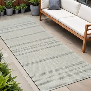 Photo of 8' Cream and Beige Striped Distressed Indoor Outdoor Runner Rug