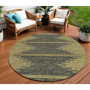 Photo of 8' Dark Gray And Gold Round Abstract Washable Indoor Outdoor Area Rug