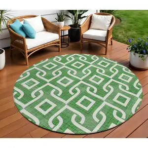 Photo of 8' Emerald And Ivory Round Geometric Washable Indoor Outdoor Area Rug