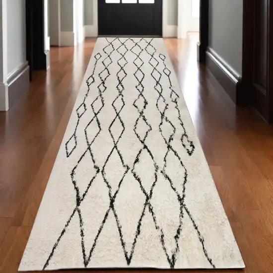 10' Black and Ivory Geometric Shag Runner Rug Photo 1