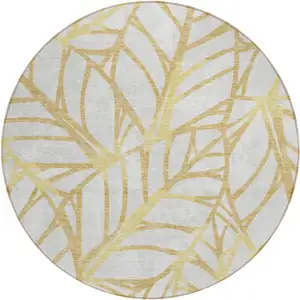 Photo of 8' Gold And Beige Round Floral Washable Indoor Outdoor Area Rug