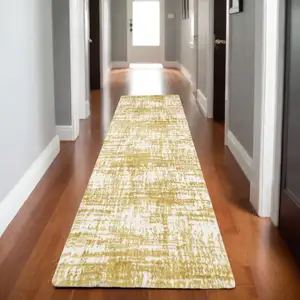 Photo of 8' Gold And Ivory Abstract Runner Rug