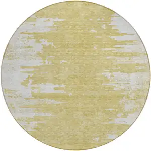 Photo of 8' Gold And Ivory Round Abstract Washable Indoor Outdoor Area Rug