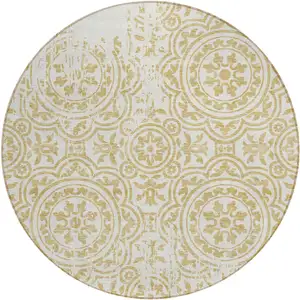 Photo of 8' Gold And Ivory Round Medallion Washable Indoor Outdoor Area Rug