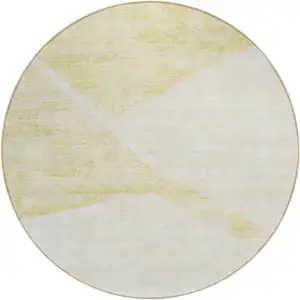 Photo of 8' Gold Beige And Ivory Round Abstract Washable Indoor Outdoor Area Rug