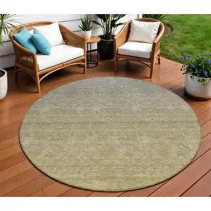 Photo of 8' Gold Beige And Taupe Round Ombre Washable Indoor Outdoor Area Rug