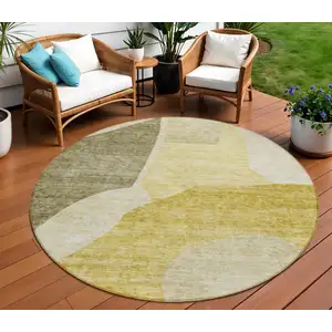 Photo of 8' Gold Beige And Wheat Round Abstract Washable Indoor Outdoor Area Rug