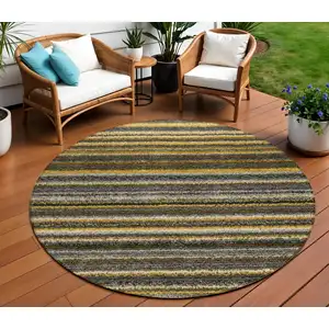 Photo of 8' Gold Beige And Wheat Round Striped Washable Indoor Outdoor Area Rug