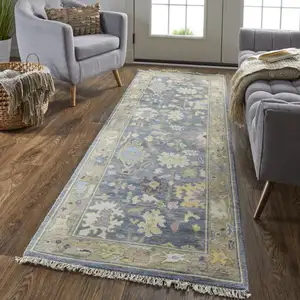 Photo of 8' Gold Blue and Purple Wool Oriental Hand Knotted Runner Rug With Fringe