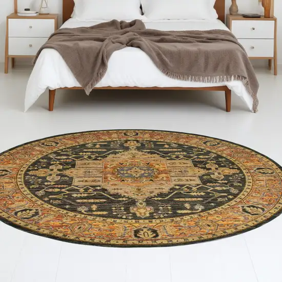 8' Black and Gold Round Oriental Power Loom Area Rug Photo 1