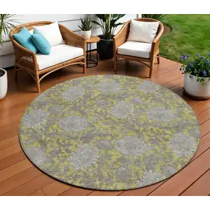 Photo of 8' Gold Gray And Charcoal Round Floral Washable Indoor Outdoor Area Rug