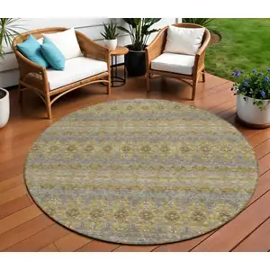 Photo of 8' Gold Gray And Silver Round Floral Medallion Washable Indoor Outdoor Area Rug