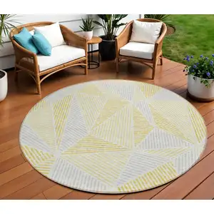 Photo of 8' Gold Gray And Wheat Round Geometric Washable Indoor Outdoor Area Rug