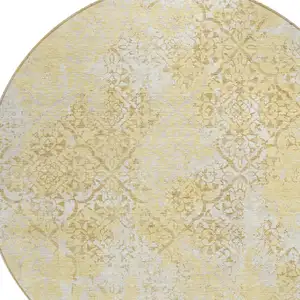 Photo of 8' Gold Wheat And Beige Round Floral Washable Indoor Outdoor Area Rug