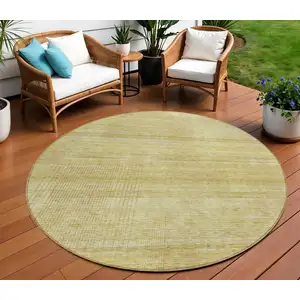 Photo of 8' Gold Wheat And Beige Round Striped Washable Indoor Outdoor Area Rug