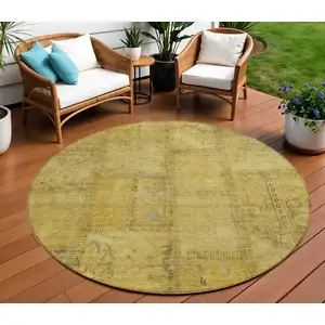 Photo of 8' Gold Wheat And Gray Round Patchwork Washable Indoor Outdoor Area Rug