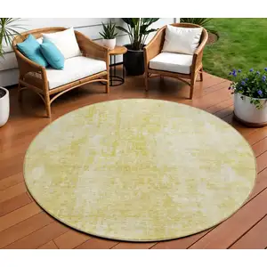 Photo of 8' Gold Wheat And Ivory Round Abstract Washable Indoor Outdoor Area Rug