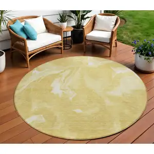 Photo of 8' Gold Wheat And Ivory Round Abstract Washable Indoor Outdoor Area Rug