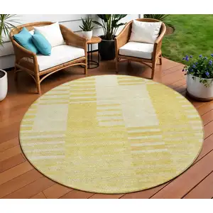 Photo of 8' Gold Wheat And Ivory Round Striped Washable Indoor Outdoor Area Rug