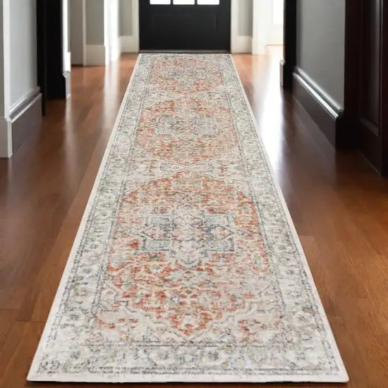 10' Gold and Ivory Oriental Power Loom Washable Runner Rug Photo 1