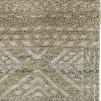 Photo of 8' Gold and Tan Geometric Hand Knotted Worn Faded Runner Rug