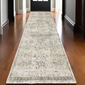 Photo of 10' Gray And Gold Medallion Hand Tufted Runner Rug