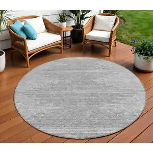 Photo of 8' Gray And Ivory Round Abstract Washable Indoor Outdoor Area Rug