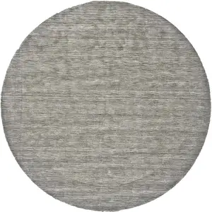 Photo of 8' Gray And Ivory Round Wool Hand Woven Stain Resistant Area Rug