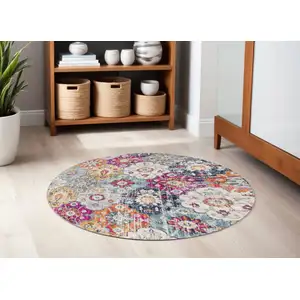 Photo of 5' Gray Beige and Blue Geometric Distressed Round Rug