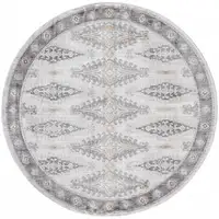 Photo of 6' Gray Blue And Orange Round Floral Stain Resistant Area Rug