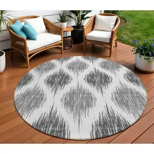 Photo of 8' Gray Ivory And Charcoal Round Ikat Washable Indoor Outdoor Area Rug