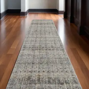 Photo of 12' Gray Ivory and Blue Abstract Power Loom Worn Faded Runner Rug With Fringe