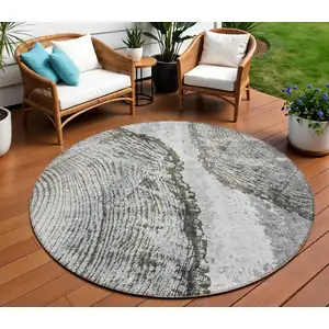 Photo of 8' Gray Taupe And Silver Round Abstract Washable Indoor Outdoor Area Rug