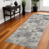 Photo of 8' Gray and Beige Abstract Distressed Area Rug