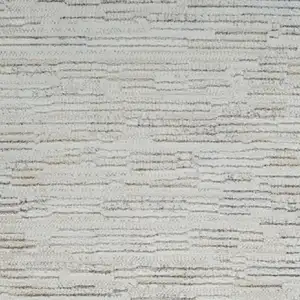 Photo of 8' Gray and Beige Geometric Distressed Area Rug