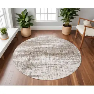 Photo of 8' Gray and Beige Round Abstract Non Skid Area Rug