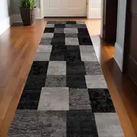 Photo of 13' Gray and Black Geometric Power Loom Distressed Runner Rug