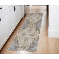 Photo of 8' Gray and Brown Medallion Power Loom Distressed Runner Rug