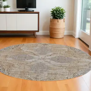 Photo of 8' Gray and Brown Round Medallion Power Loom Distressed Area Rug