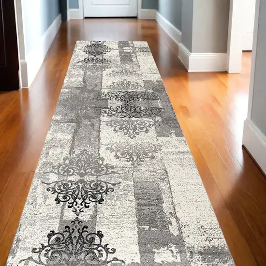 13' Gray and Ivory Damask Power Loom Distressed Runner Rug Photo 1