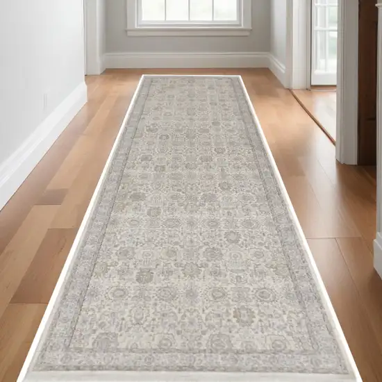 10' Gray and Ivory Oriental Power Loom Runner Rug With Fringe Photo 1