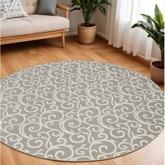 8' Gray and Ivory Round Floral Vines Power Loom Area Rug Photo 1