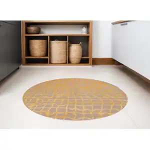 Photo of 8' Gray and Orange Round Abstract Non Skid Area Rug