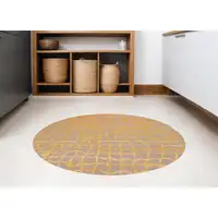 Photo of 8' Gray and Orange Round Abstract Non Skid Area Rug