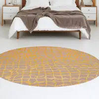 Photo of 5' Gray and Orange Round Abstract Non Skid Area Rug