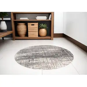 Photo of 5' Gray and White Round Abstract Non Skid Area Rug