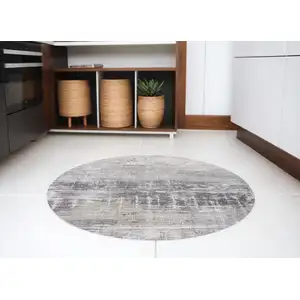 Photo of 8' Gray and White Round Abstract Non Skid Area Rug