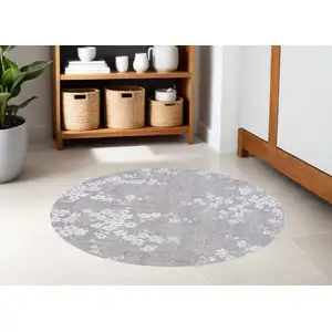 Photo of 5' Gray and White Round Oriental Non Skid Area Rug