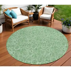 Photo of 8' Green And Artichoke Green Round Floral Washable Indoor Outdoor Area Rug