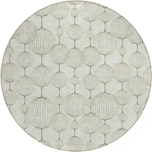 Photo of 8' Green And Beige Round Geometric Washable Indoor Outdoor Area Rug